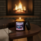 A high-quality photograph in a dimly lit, sophisticated living room. The lit amber jar candle sits on a polished dark wood side table next to a neatly folded cashmere throw blanket and a leather-bound book. 