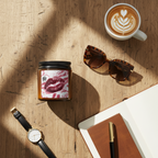 A high-quality influencer-style flat lay on an aged, reclaimed oak table. The "Destiny in Time" tank top is neatly folded next to a pair of designer tortoiseshell sunglasses, a leather-bound journal with a fountain pen, and a minimalist gold watch. A ceramic cup of artisanal coffee sits nearby. Natural daylight streams in from a window to the left. The aesthetic is clean, expensive, and curated.
 
